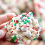 hand holding white chocolate peanut cluster