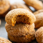 stack pumpkin ginger cookies with bite out of the top one