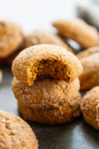stack pumpkin ginger cookies with bite out of the top one