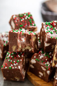stack of rocky road fudge with one piece with a bite out of it