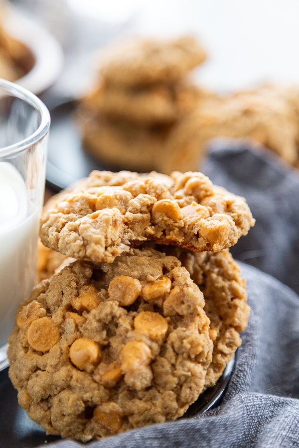 oatmeal peanut butter butterscotch chip cookies in stack with bite out of it