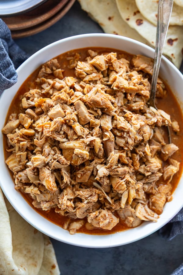 overhead shot of mexican chicken in white bowl